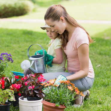 Mother gardening with her daughter.