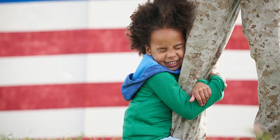 child hugging military parent